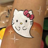 Halloween Kitty Boo arm paint - Olivian Face Paint